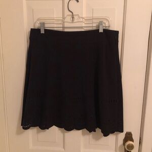 Black flounce skirt with cutout detail by LOFT. Size 10